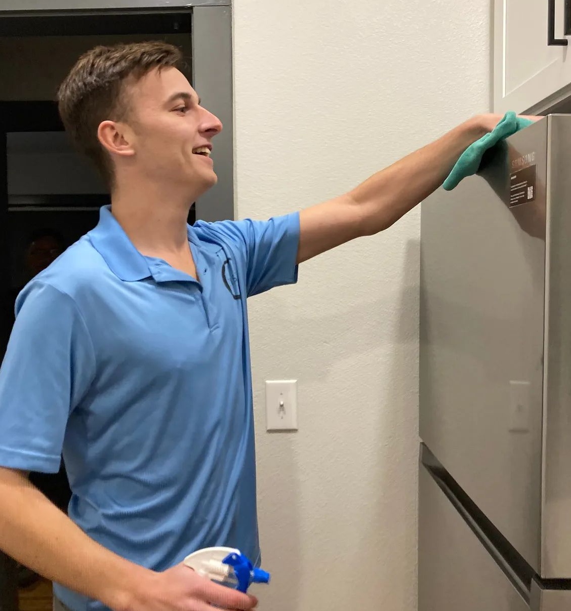 avery-cleaning-above-fridge-2